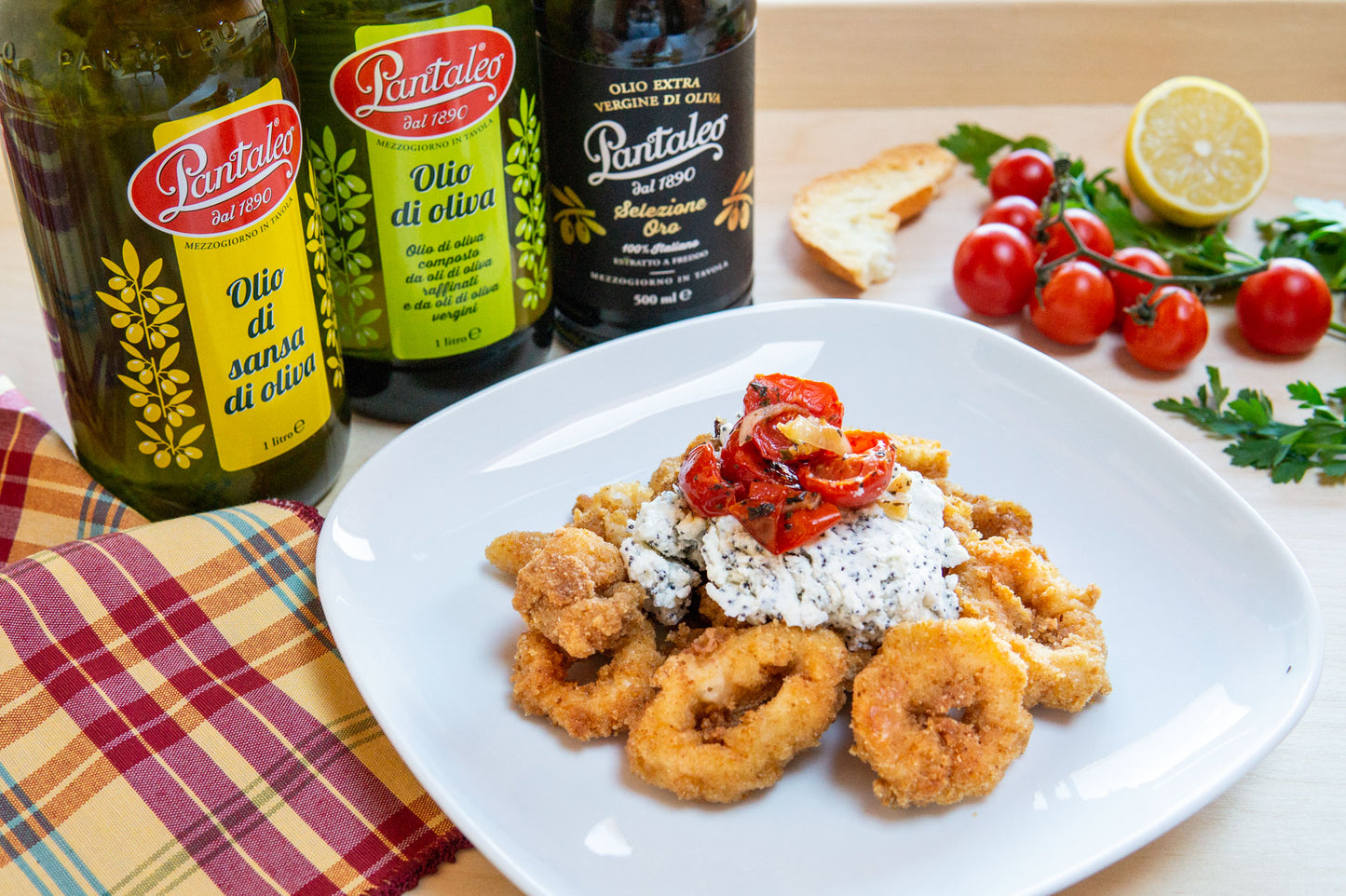 Olio Pantaleo - Calamari panati al forno con crema di ricotta, semi di papavero e pomodorini arrosto